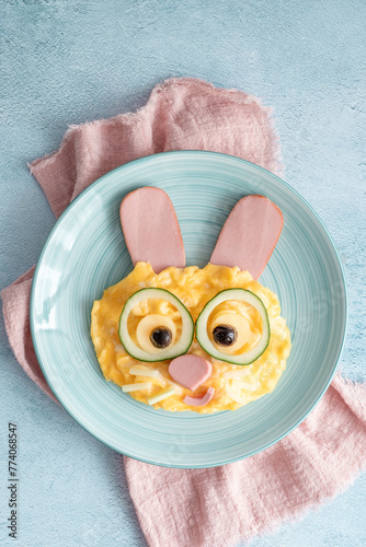 Easter breakfast scrambled eggs with cute bunny face