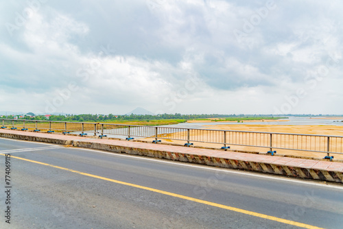 Highway over the bridge. Central Vietnam, cloudy day.