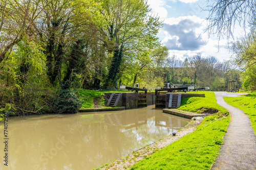 A view along the Grand Union Canal towards the Aylestone Mill lock in Aylestone Meadows, Leicester, UK in Springtime photo