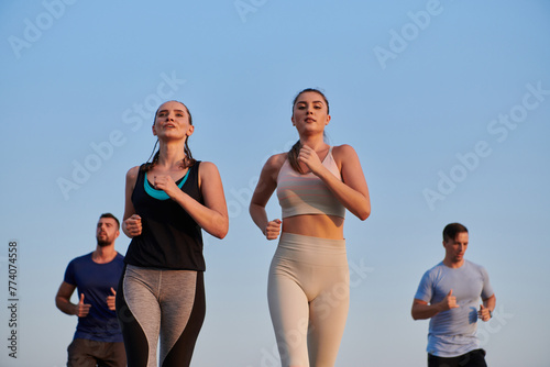 A group of friends maintains a healthy lifestyle by running outdoors on a sunny day  bonding over fitness and enjoying the energizing effects of exercise and nature