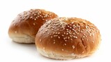 Burger bun with sesame seeds on top, isolated on white background. Recently baked, golden brown color with a sprinkle of sesame seeds.