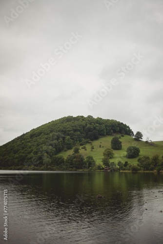 Vertical shot of a forested hill near Ullswater Lake, England