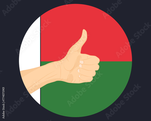 Hand approve sign with Madagascar flag, thumb up, approval or vote concept
