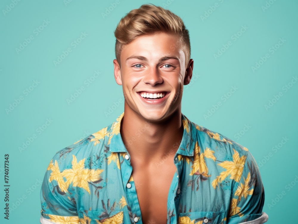 A man with a smile on his face is wearing a floral shirt A man with a smile on his face is wearing a floral shirt