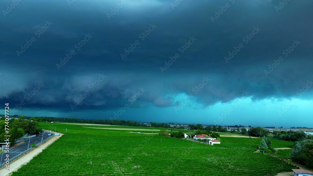 Φωτογραφία Drone Flying over vineyard with hail storm clouds in background, Paarl South Africa