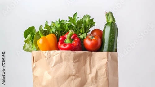 Vegetables and fruits on white paper bag. Vegetarian food.