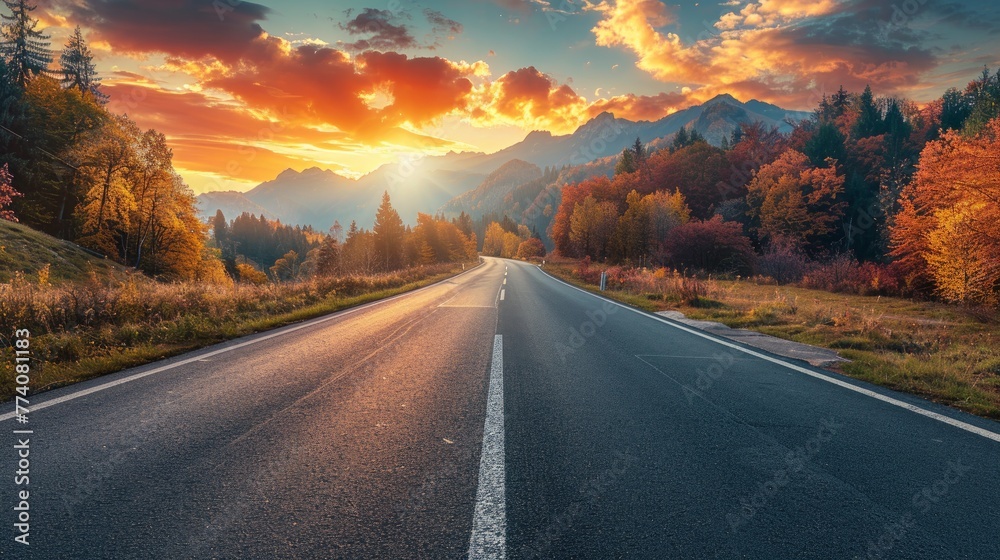 Black asphalt road landscape at sunset in beautiful colorful nature. Highway scenery among mountains in autumn season. Nature landscape on beautiful road in colorful fall. Autumn landscape in Germany