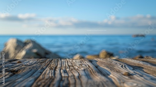 Fototapeta Naklejka Na Ścianę i Meble -  Wooden surface with a blurred background featuring the sea