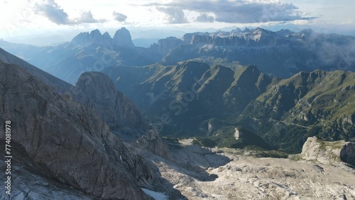 Aerial of the Marmolada mountain and greenery of the Dolomites range in Italy