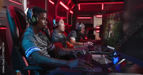 Professional esports gamers celebrating a win at a gaming tournament