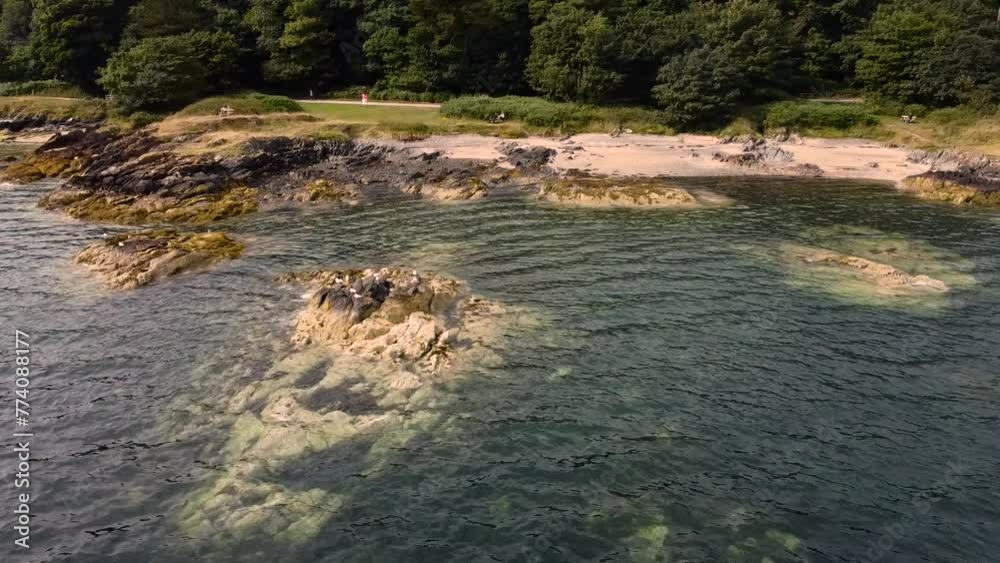 Drone shot of the rocky Helens bay shoreline in Northern Ireland by a scenic seascape Drone shot of the rocky Helens bay shoreline in Northern Ireland by a scenic seascape