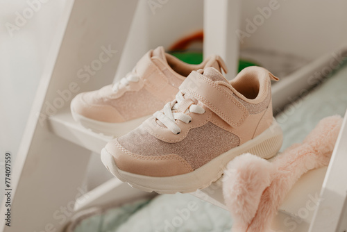 Child's pink sneakers. Cute girl's shoes
