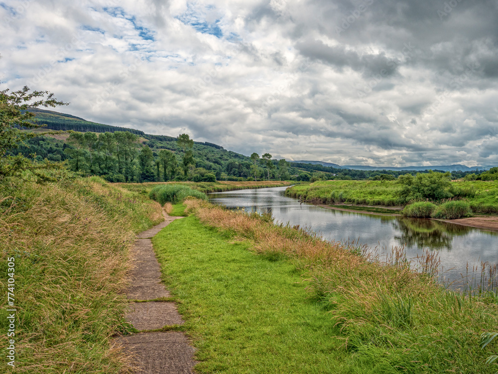 River Roe Flowing Through Lush Green Countryside