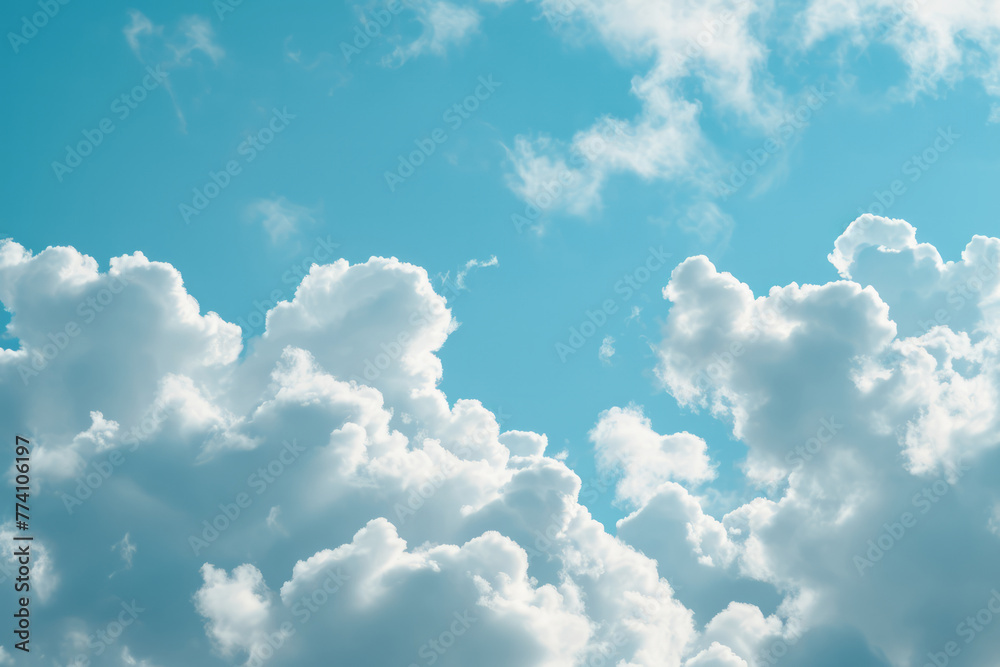 A blue sky with numerous white fluffy clouds scattered across it A blue sky with numerous white fluffy clouds scattered across it
