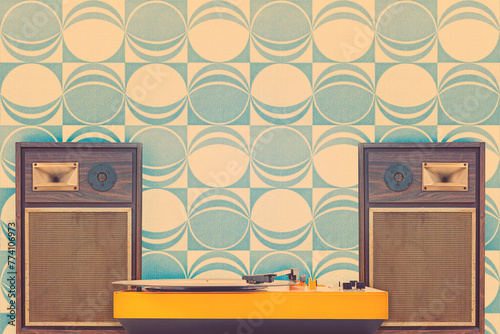 Record player with two vintage stereo speakers in front of retro seventies wallpaper