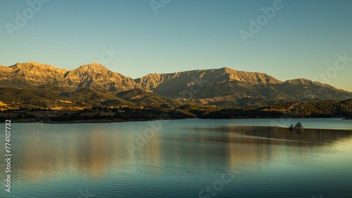 Landscape view of Erymanthos mountain range seen from Peiros lake and dam photo