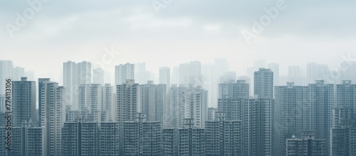 Urban landscape featuring skyscrapers and a scattering of clouds in the sky  depicting a modern metropolitan area