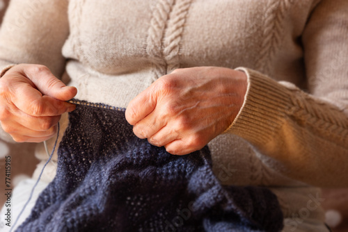 Woman knitting at home, close-up © Irina