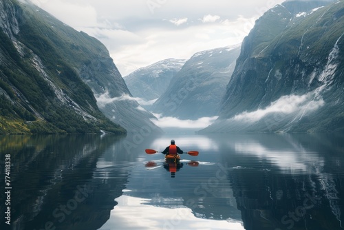 Serene Kayak Journey in Alpine Mountain Lake Reflection