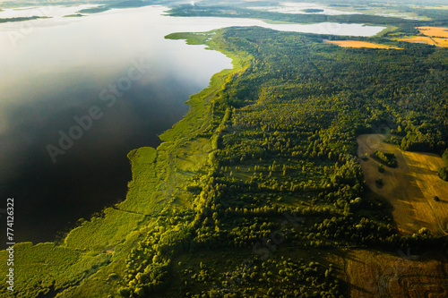 Top view of lake Drivyaty in the forest in the Braslav lakes National Park at sunset, the most beautiful places in the city of Belarus.An island in the lake.Belarus.