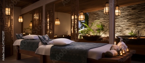 The cozy interior of a room with two beds adorned with candles on the side tables  creating a warm and inviting ambiance
