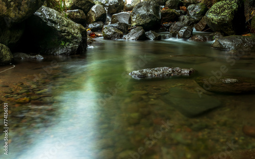 Stream water long exposure shot with rocks © Johnster Designs