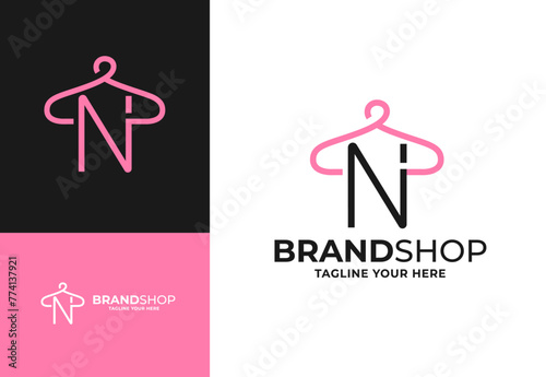 Clothes hanger for N initial logo vector, Minimalist boutique logo design illustration. Initial capital letter N elegant hanger icon
