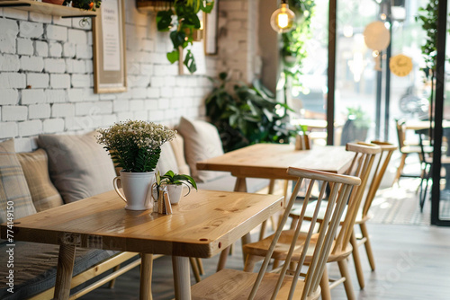 Photo of a cozy, bright cafe in a modern minimalist style, with indoor plants and flowers, with a simple and functional interior. The cafe is decorated in light colors using natural materials