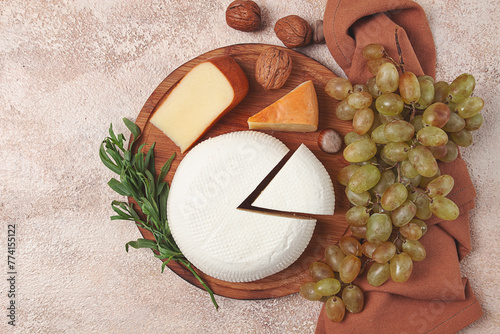 Georgian cheese, Imeretian and smoked suluguni, grapes, nuts, on a cutting board, Georgian cuisine, no people, photo