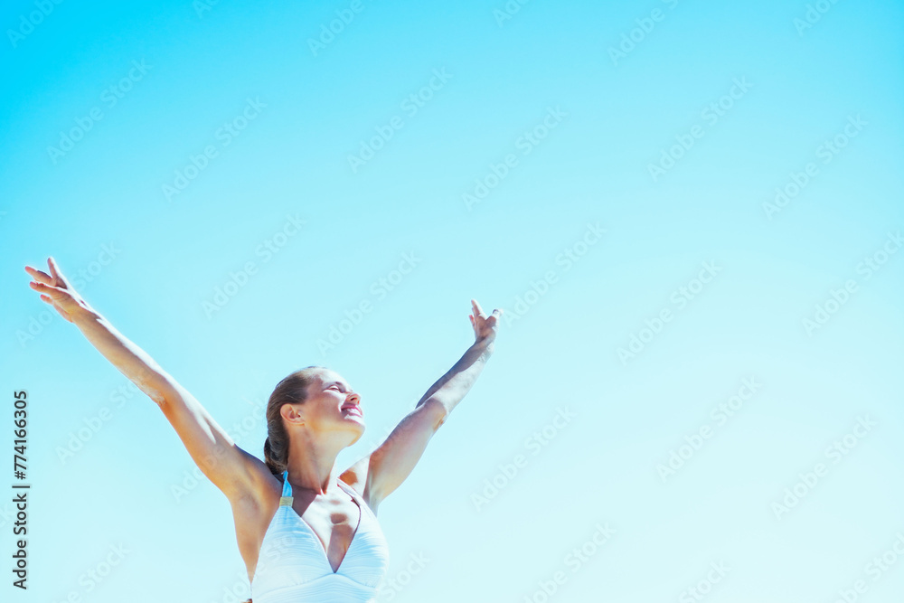 young woman walking rejoicing on sea sho young woman walking rejoicing on sea sho