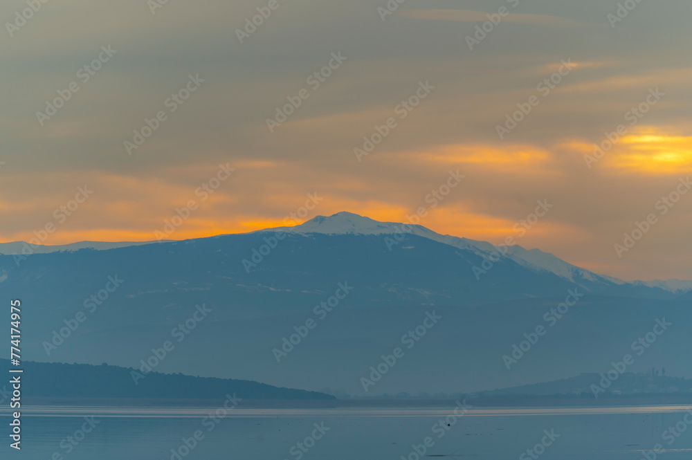 Fototapeta premium Balıkesir Lake Manyas at sunset boats reflection vegetation cloudy sky