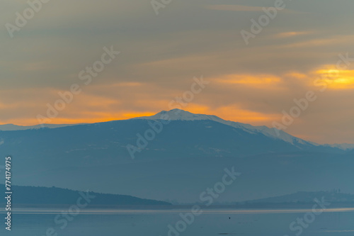 Balıkesir Lake Manyas at sunset boats reflection vegetation cloudy sky