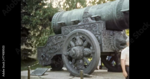 Tsar cannon historic landmark. 1980s retro Moscow, Russia. Tourist taking photo near ancient architecture monument. Tourism to history weapon museum. Archival vintage color film. Archive Travel video