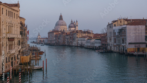 View of Grand Canal and Basilica Santa Maria della Salute seen from the Rialto Bridge on a hazy winter evening, Venice, Veneto, Italy © Sebastian