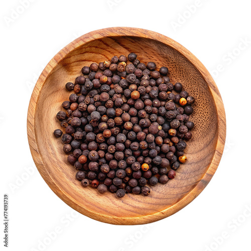 Dry juniper berry in wood plate on transparent background