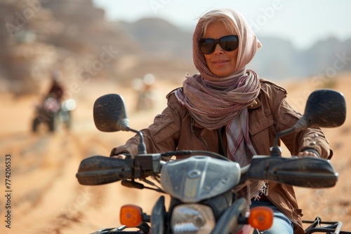 A person on a motorbike faces a vast desert landscape, suggesting adventure, travel, and exploration