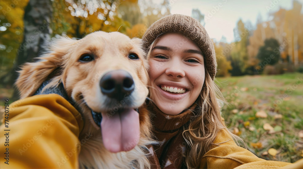Smiling woman taking selfie with her dog
