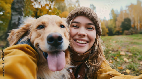 Smiling woman taking selfie with her dog © brillianata