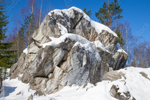 Marble rock in Ruskeala Mountain Park on a sunny March day. Karelia, Russia photo