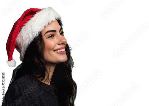 Woman in santa hat. Close-up of smiling woman in dark shirt and Santa hat looking sideways on light transparent background. Christmas elements.