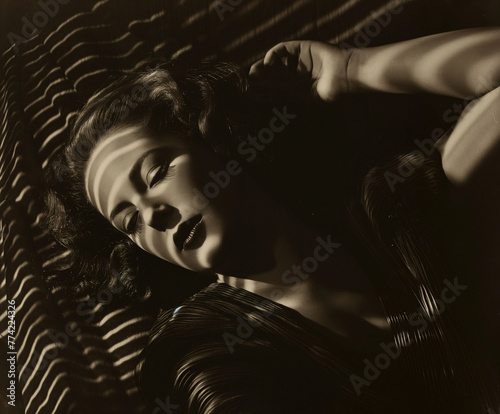 noir fashion portrait of caucasian woman with eyes closed photo