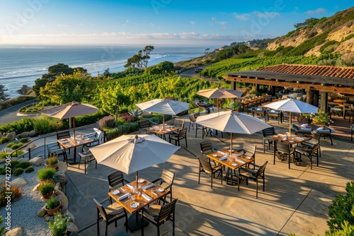 Aerial view of an outdoor dining area featuring tables with umbrellas arranged neatly  ready for customers to enjoy a meal