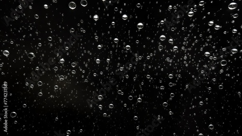 A black and white photo of a cloudy sky with many small droplets of water