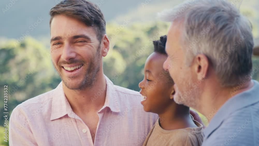 Portrait of laughing and smiling three generation male family standing outdoors in countryside - shot in slow motion Portrait of laughing and smiling three generation male family standing outdoors in countryside - shot in slow motion