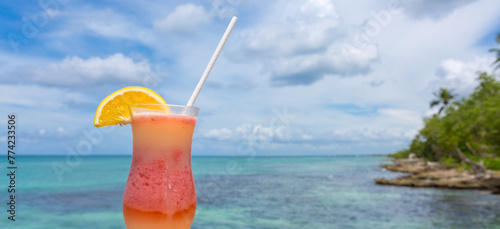 Travel background with drinks Bocal on Caribbean beach.