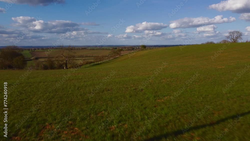 Aerial 4k view flying close to objects over the UK countryside in Spring. Aerial 4k view flying close to objects over the UK countryside in Spring.