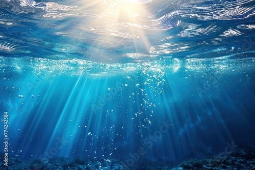 Underwater background with blue water and sun rays photo