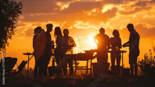 silhouette of Happy adult friends barbecuing at sunset party in park