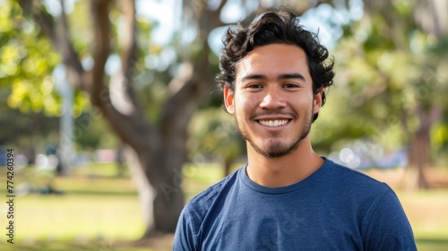 Young hispanic man smiling confident standing at park