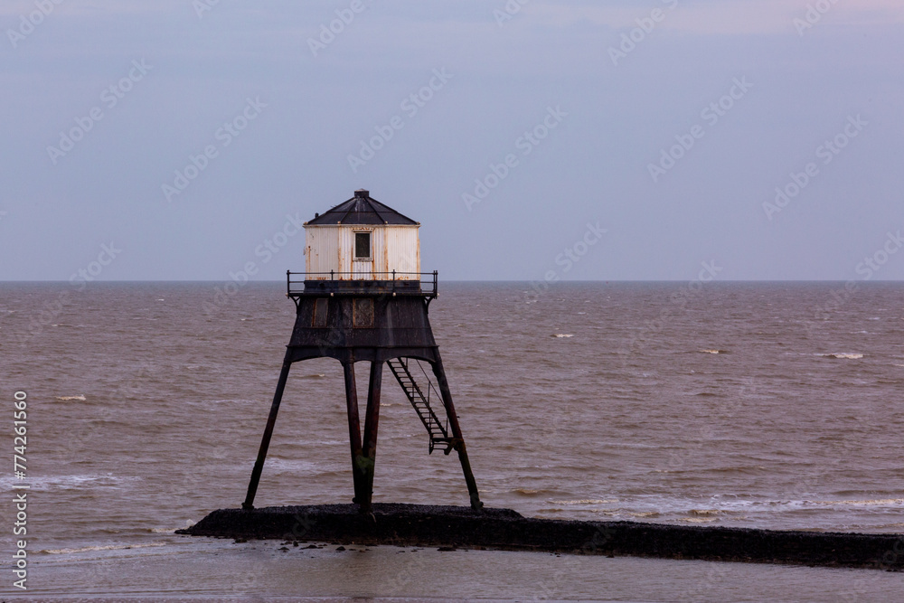 Lighthouse in the sea, Dovercourt low lighthouse at low tide built in 1863 and discontinued in 1917 and restored in 1980 the 8 meter lighthouse is still a iconic sight during low tide